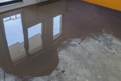 Floor covering with self leveling cement mortar. Mirror smooth surface of the floor